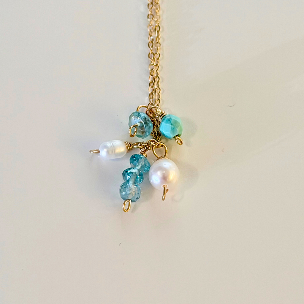 Mystic Blue Topaz Cluster Necklace 14k gold filled close up on a white background